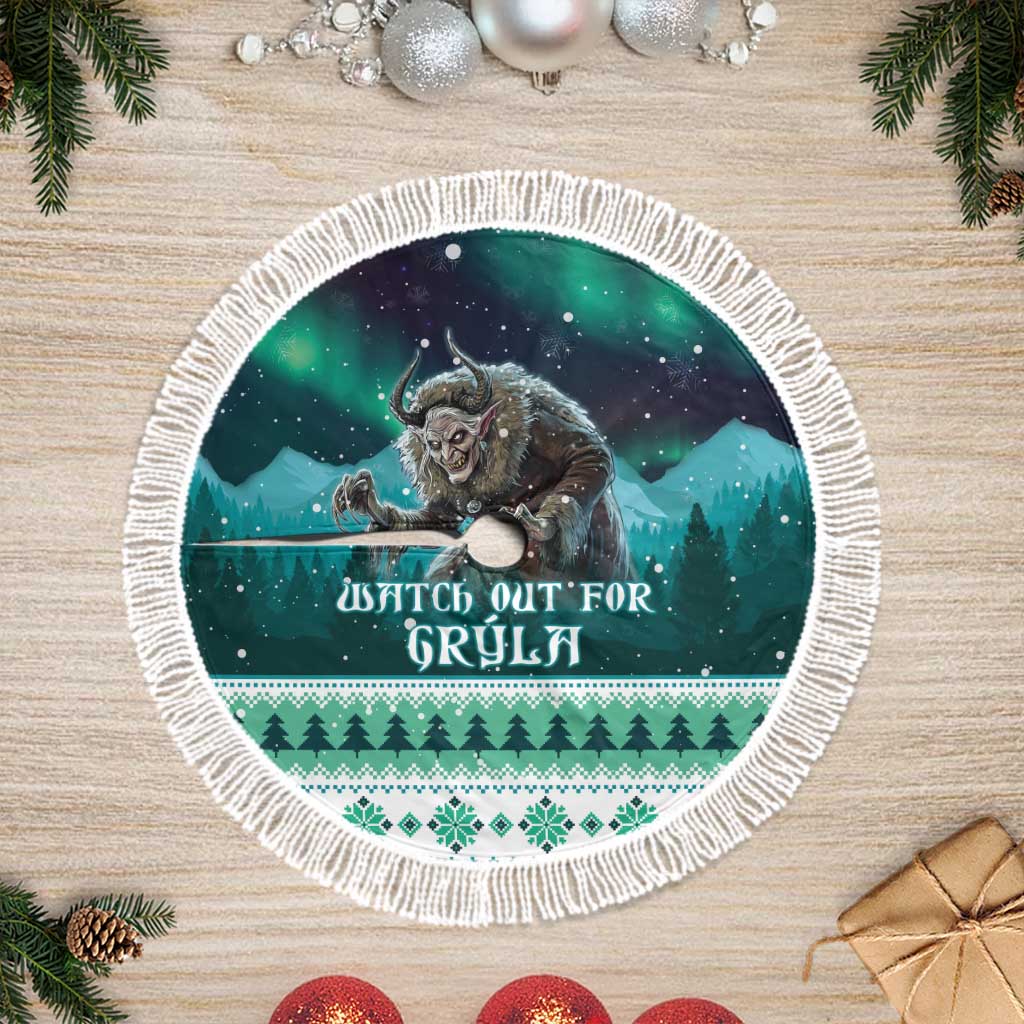 Green round tree skirt with white tassel fringe, wolf and forest night graphic