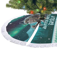 Green round tree skirt with white fringed edge, wolf artwork and starry sky print