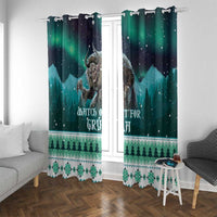 Green and dark blue window curtains with Gryla print and “Watch out for Gryla” text