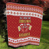 Red Christmas quilt with patterned border and cartoon sausage graphic with text