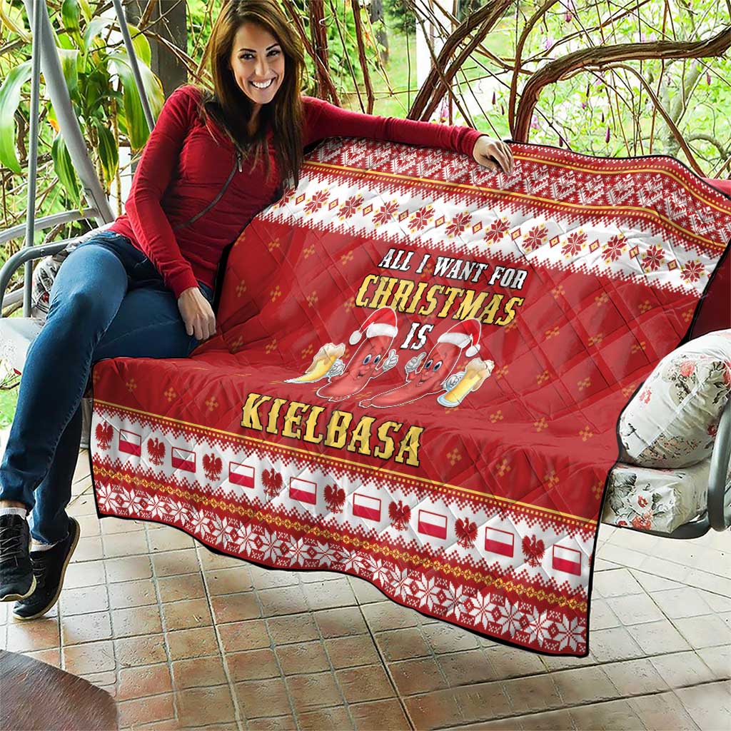 Red Christmas quilt held outdoors with border pattern and sausage graphic and text