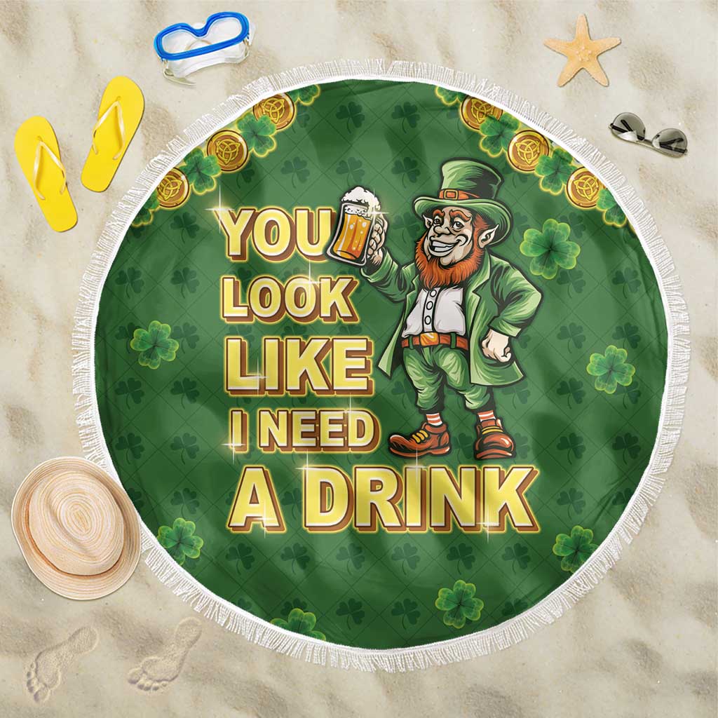 Green round fringe beach blanket with clovers, leprechaun beer and 'YOU'LL LOOK LIKE I NEED A DRINK'