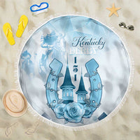 Blue round beach blanket with fringe edge and Kentucky Derby crest print