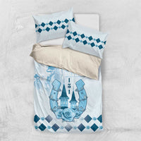 Folded blue and white bedding set with Kentucky Derby print and diamond-pattern pillowcases