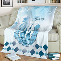 Blue horse-themed blanket on couch with Kentucky Derby text, castle graphic and diamond trim