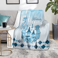 Blue horse-themed blanket on rug with Kentucky Derby logo, roses and dark-blue diamond pattern