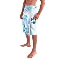 Blue and white lavalava wrap skirt shown from the side with tall blue graphic