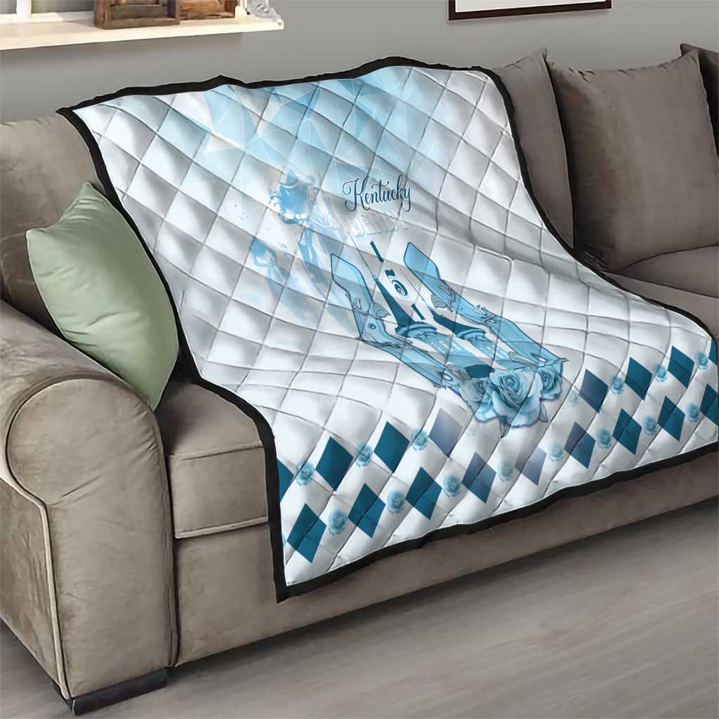 White quilt with blue Kentucky horse logo and diamond border along edge