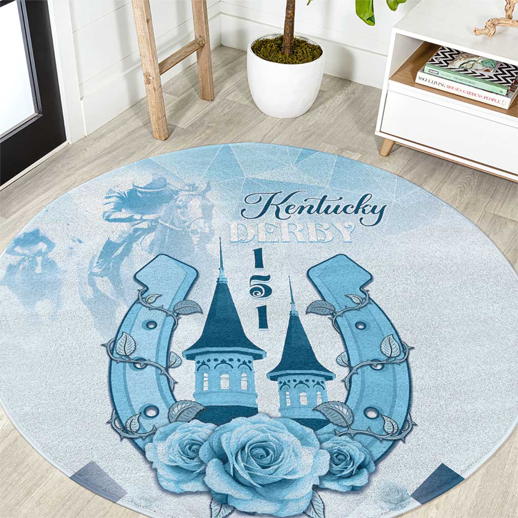 Blue round carpet with Kentucky Derby script, central castle, flanking horses, and roses