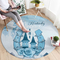 Blue round carpet with Kentucky Derby text, horse carousel graphic, and blue roses