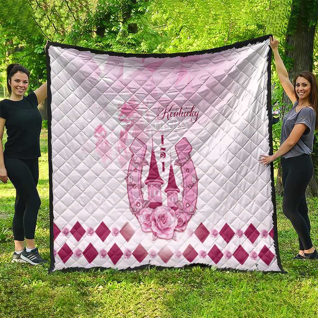 Pink and white quilt featuring Kentucky text, horse emblem, and diamond-pattern border