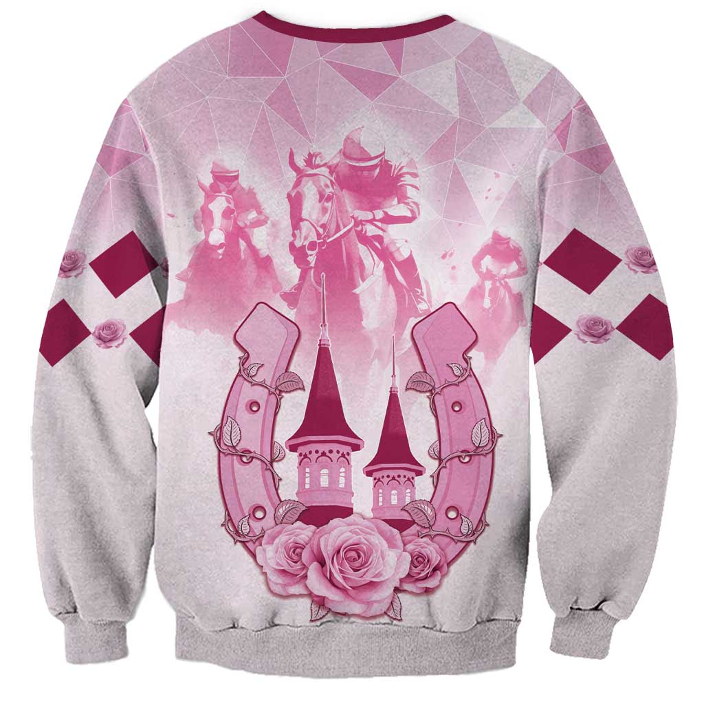 Pink and gray sweatshirt with burgundy trim and horse-racing crest graphic