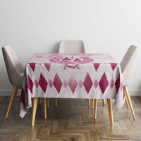 Pink tablecloth with large diamond pattern and floral centerpiece graphic on round table