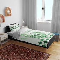 Green and white bedding set with Kentucky Derby design on duvet and two matching pillows