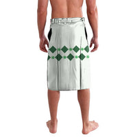 Green diamond-pattern lavalava wrap skirt with elastic waistband, back view, white base