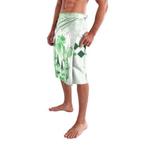 Green graphic lavalava wrap skirt with elastic waistband, side view, white base