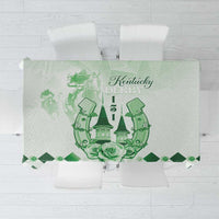 Green tablecloth with horse-themed crest and floral border design
