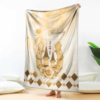 Beige blanket held upright, displaying gold Kentucky Derby emblem with roses and checkered diamonds