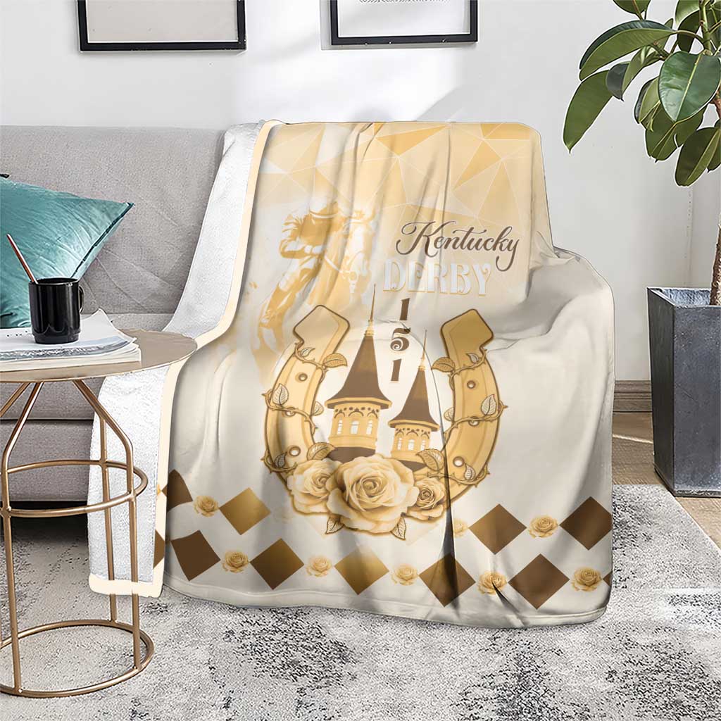 Beige blanket shown draped over seating, with gold Kentucky Derby logo and checkered diamonds