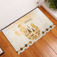 Beige rubber doormat showing gold Kentucky Derby emblem with boots, horseshoe, and rose.