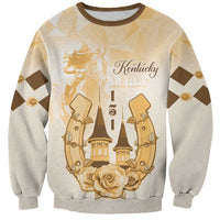 Beige crewneck sweatshirt with Kentucky Derby 151 gold graphic, roses and horse riders.