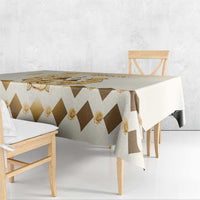 Beige tablecloth with brown diamond pattern and gold rose trim