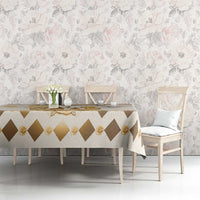 Beige tablecloth with brown diamond pattern and gold rose details on dining table