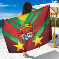 Red and green diagonal striped sarong with yellow stars and central crest graphic