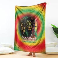 Rainbow tie-dye blanket featuring lion graphic, “1 8 6 5,” and “Freedom Juneteenth”