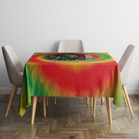 Juneteenth Freedom Day tablecloth with red-to-green rainbow tie-dye and ornate center graphic