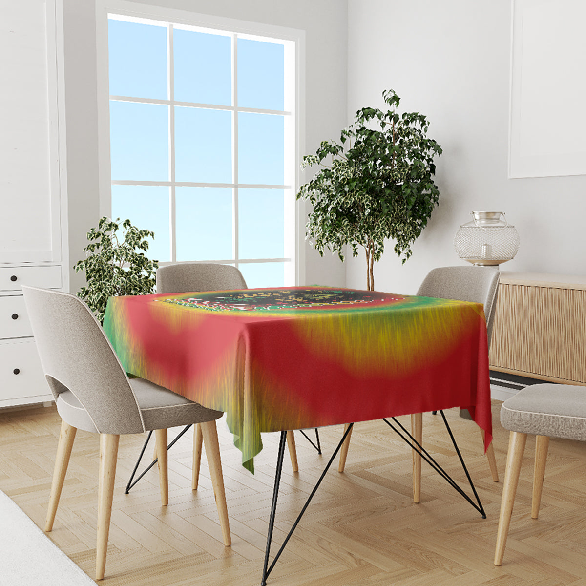 Juneteenth Freedom Day tablecloth featuring red, green, and yellow reggae tie-dye on dining table