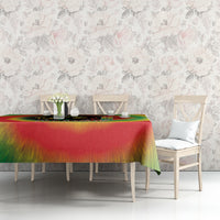 Juneteenth Freedom Day tablecloth in red and rainbow tie-dye with green hanging edge