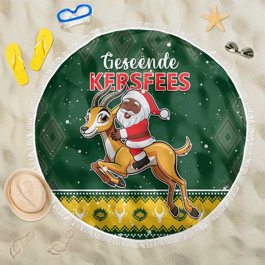 Green round beach blanket with Santa and springbok graphic, white fringed border