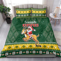 Green Christmas bedding set on bed with Santa riding springbok and festive geometric border