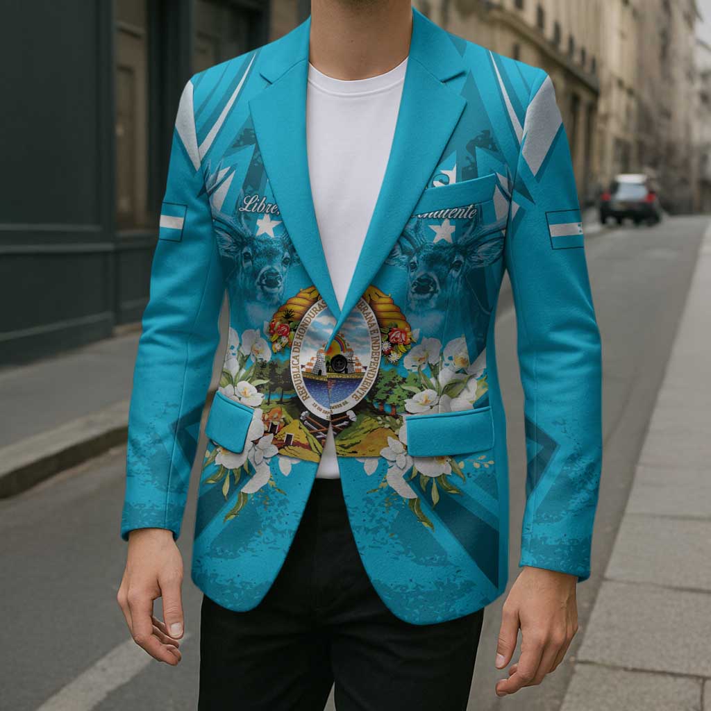 Unisex teal-blue blazer with crest and floral print; light-blue cuffs and pocket flaps.