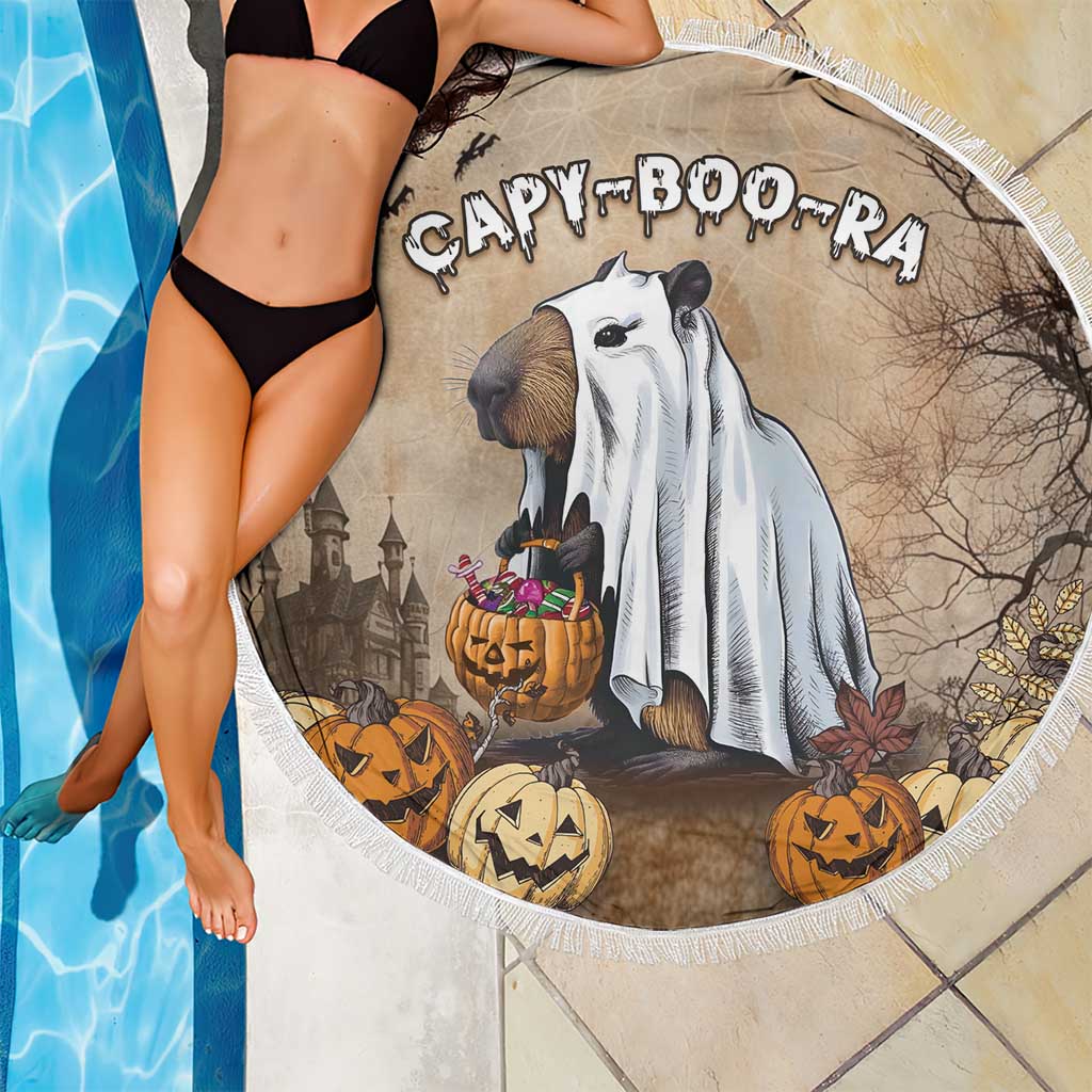 Close-up round Halloween beach blanket with fringe edge, beige CAPY BOO-RA capybara and pumpkins