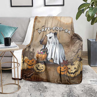 Halloween blanket with capybara ghost and pumpkins, draped on a living-room rug