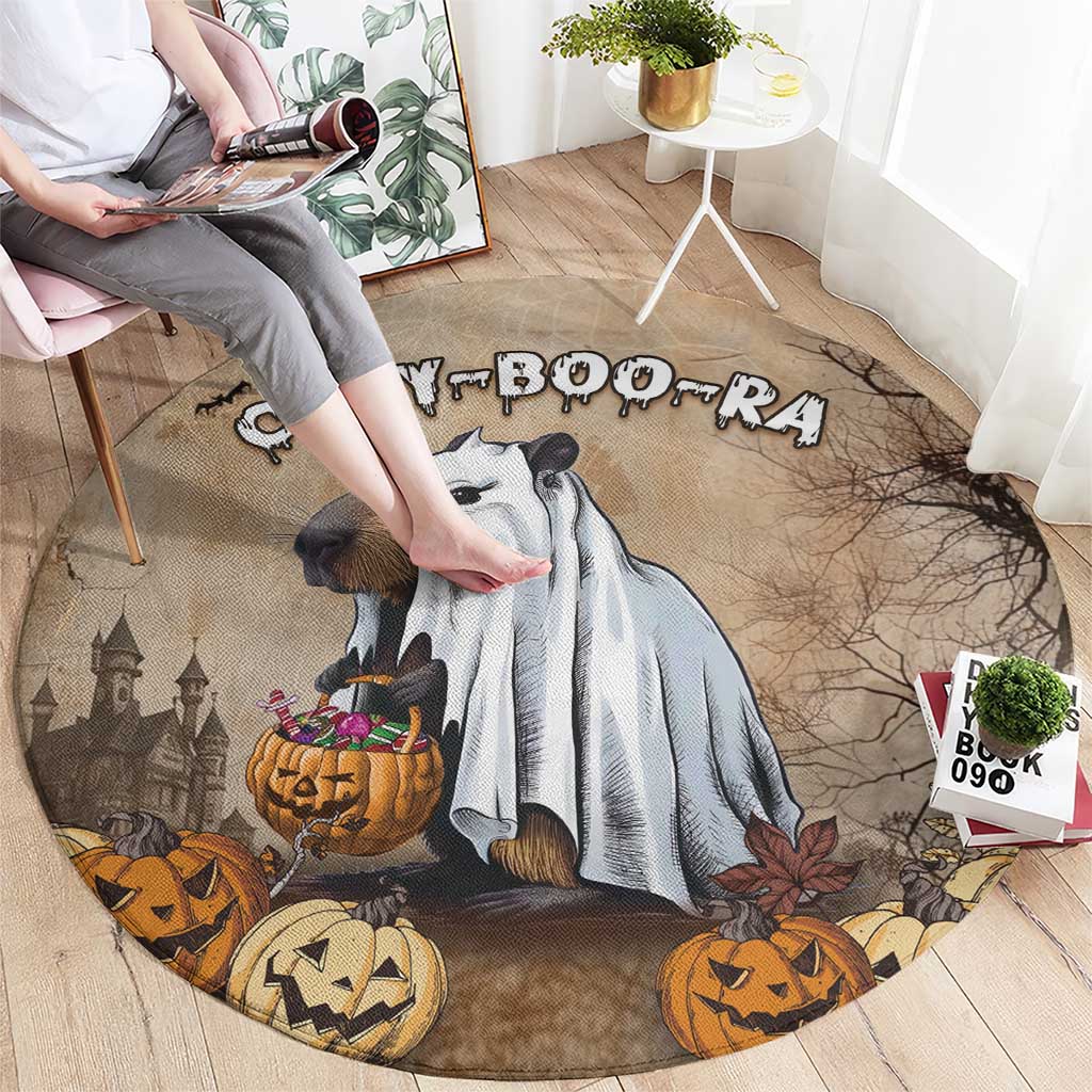 Beige round Halloween rug with capybara and jack-o’-lanterns, top view