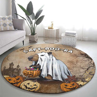 Beige round Halloween rug with capybara, pumpkins, and tree-branch artwork