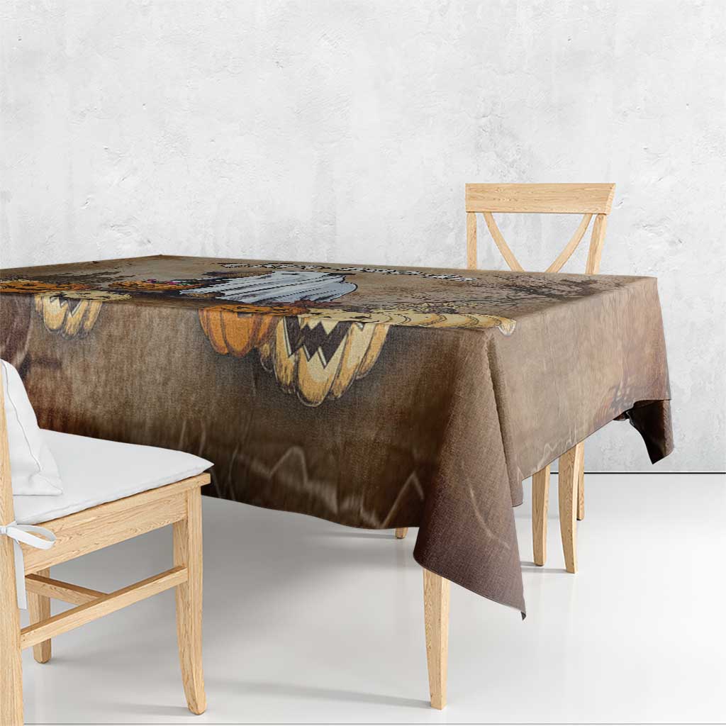 Brown Halloween tablecloth corner with capybara, pumpkins, and batwing patterns