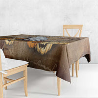 Brown Halloween tablecloth corner with capybara, pumpkins, and batwing patterns