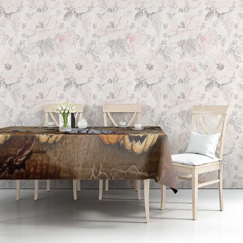 Brown Halloween tablecloth with capybara and pumpkins, framed by dark branches