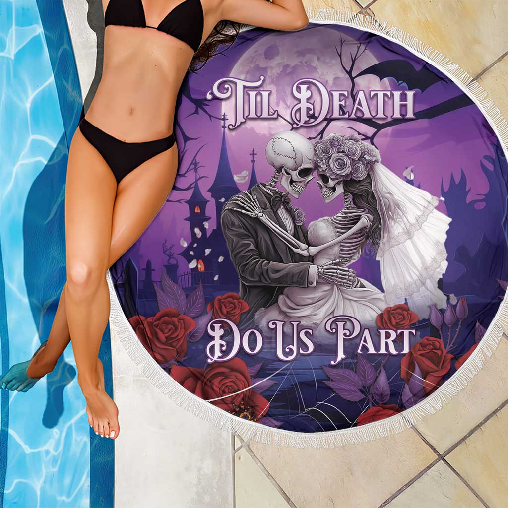 Purple round beach blanket showing a skeleton couple holding roses and floral accents, fringed