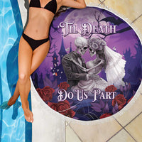 Purple round beach blanket showing a skeleton couple holding roses and floral accents, fringed