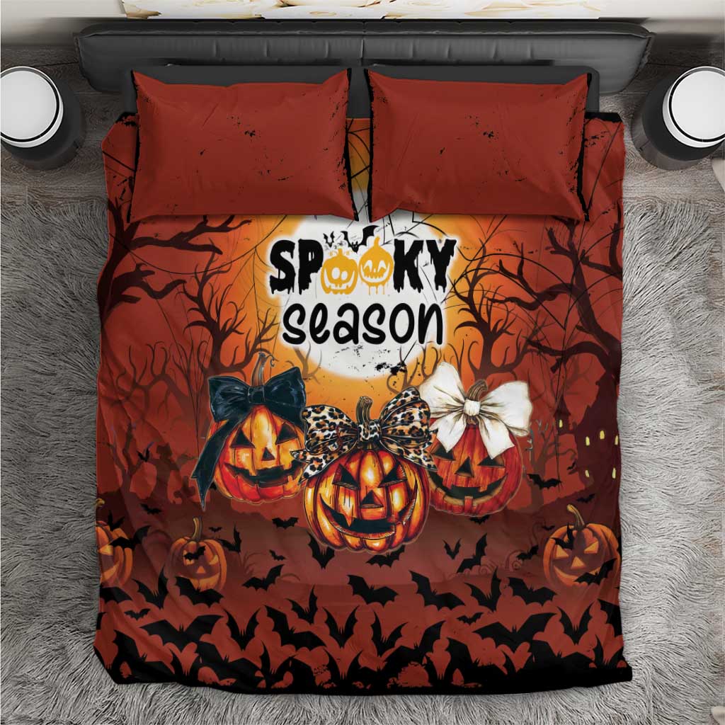Orange Halloween bedding set with two pillowcases and spooky pumpkin graphic center panel