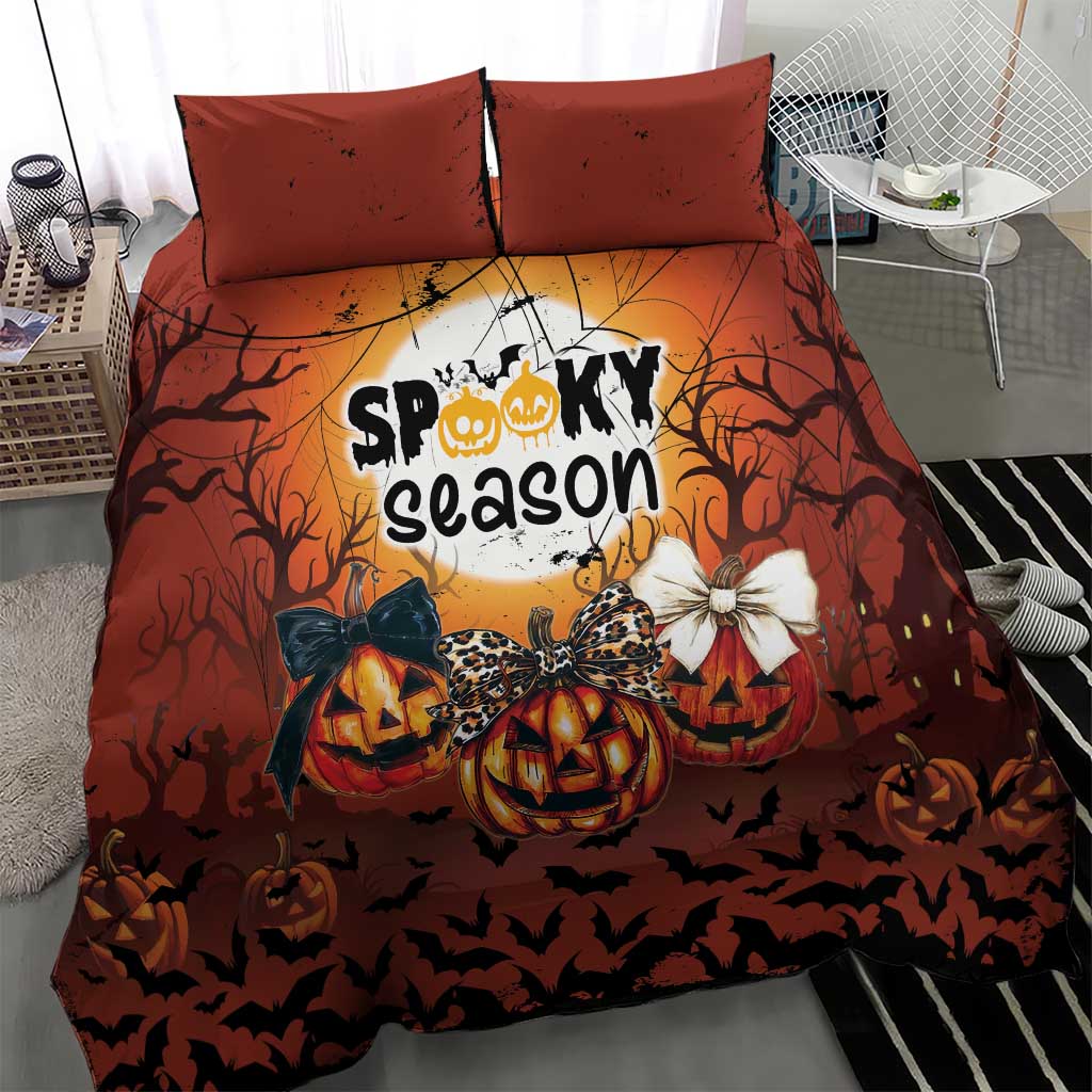 Orange Halloween bedding set with two pillowcases and “Spooky season” pumpkin artwork