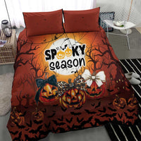 Orange Halloween bedding set with two pillowcases and “Spooky season” pumpkin artwork