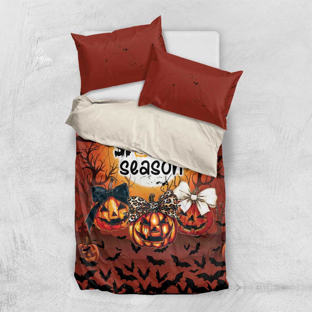 Orange and white Halloween bedding set featuring a duvet and two orange pillowcases
