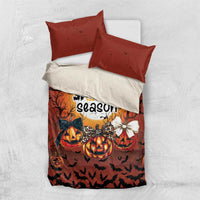 Orange and white Halloween bedding set featuring a duvet and two orange pillowcases
