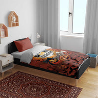 Orange Halloween bedding set with duvet and two pillowcases on a bed in a bedroom